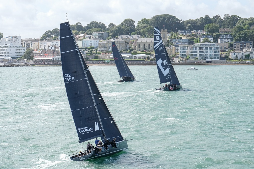 Three yachts sailing towards Cowes for the 2023 Cowes Week